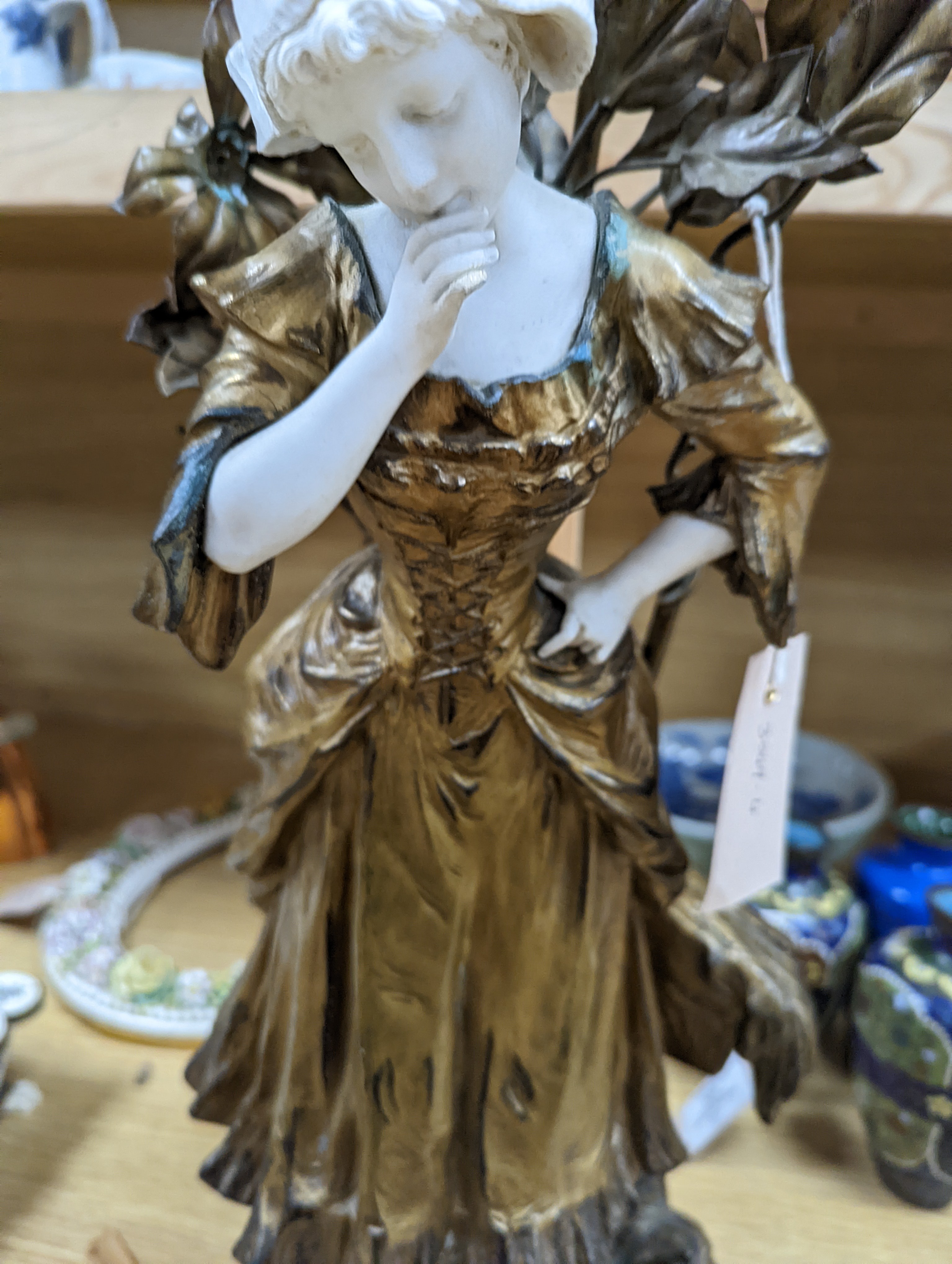 A late 19th Century French gilt spelter and bisque porcelain figure after Mednat 54cm